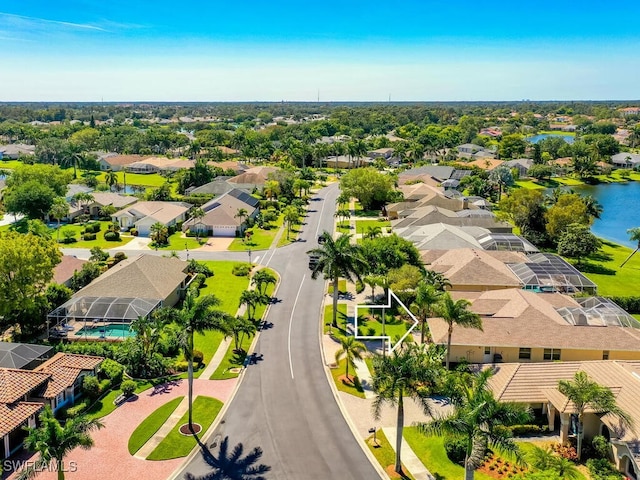 birds eye view of property with a water view