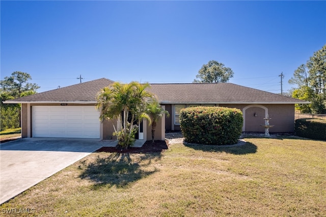 ranch-style home with a garage and a front yard