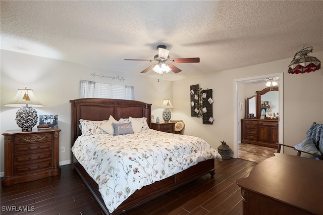 bedroom with ceiling fan and a textured ceiling