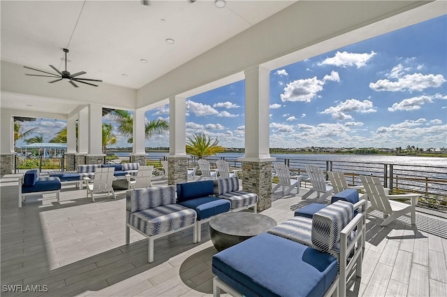 view of patio / terrace featuring outdoor lounge area, a water view, and ceiling fan