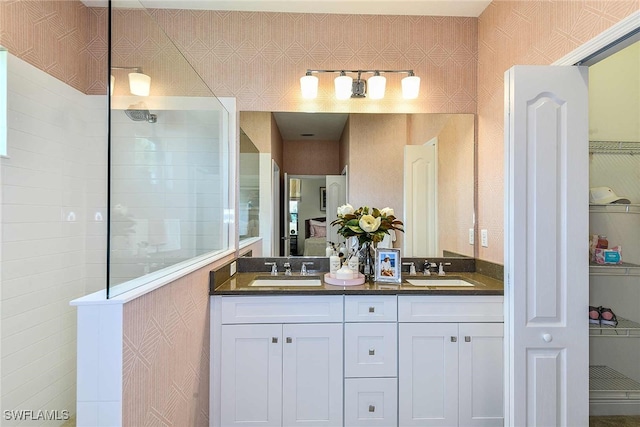 bathroom featuring vanity and walk in shower