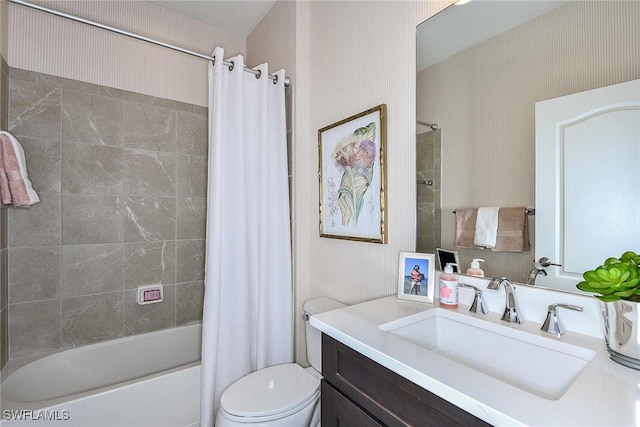 full bathroom with vanity, toilet, and shower / tub combo with curtain