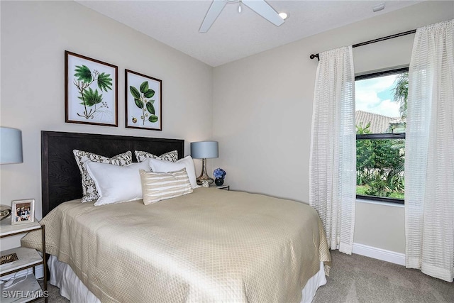 bedroom with ceiling fan and carpet