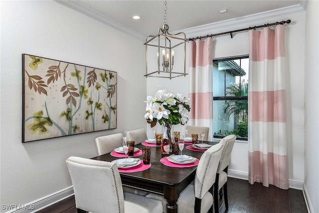 dining area with dark wood-type flooring, a notable chandelier, and ornamental molding