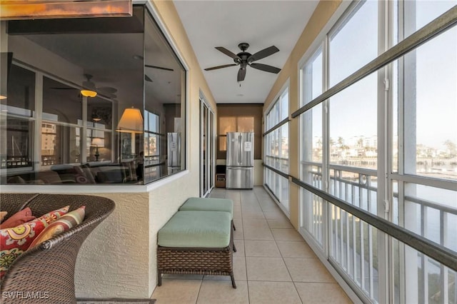 interior space featuring light tile patterned floors and expansive windows