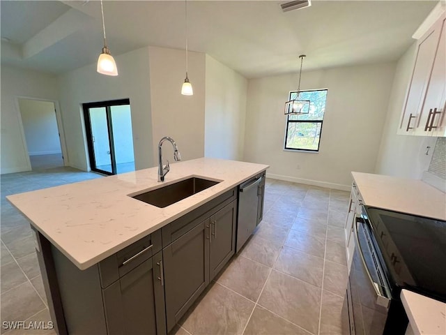 kitchen with sink, light stone counters, stainless steel dishwasher, an island with sink, and pendant lighting