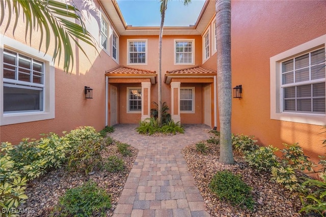 property entrance featuring a patio area