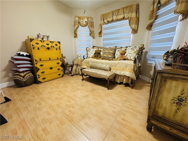 bedroom featuring baseboards