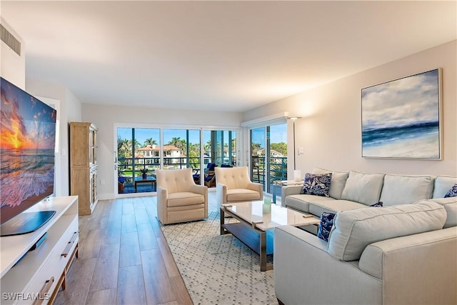 living room with light hardwood / wood-style flooring