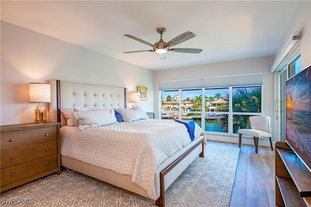 bedroom featuring hardwood / wood-style flooring and ceiling fan