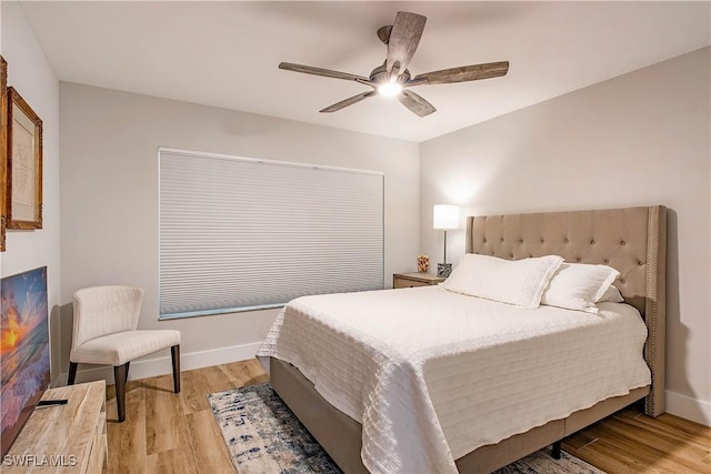 bedroom featuring ceiling fan and light hardwood / wood-style floors