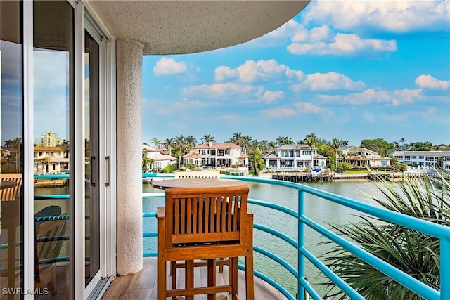 balcony featuring a water view