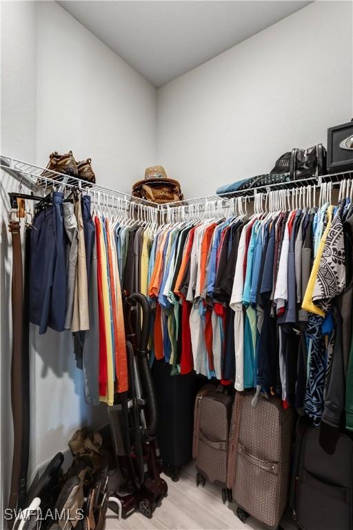 walk in closet featuring light hardwood / wood-style floors