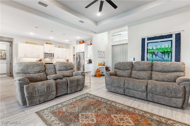 living room featuring ceiling fan