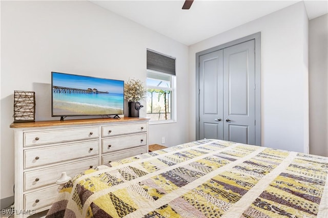 bedroom featuring ceiling fan and a closet