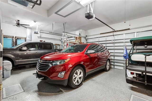 garage featuring ceiling fan and a garage door opener