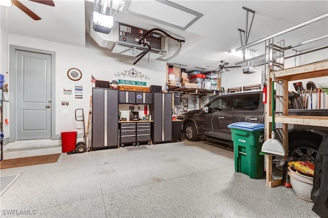 garage featuring ceiling fan and a garage door opener