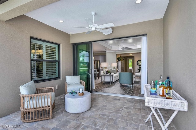 view of patio / terrace featuring ceiling fan