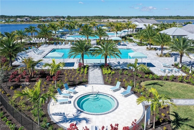 birds eye view of property featuring a water view