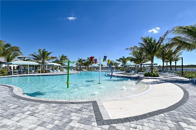 view of swimming pool featuring pool water feature