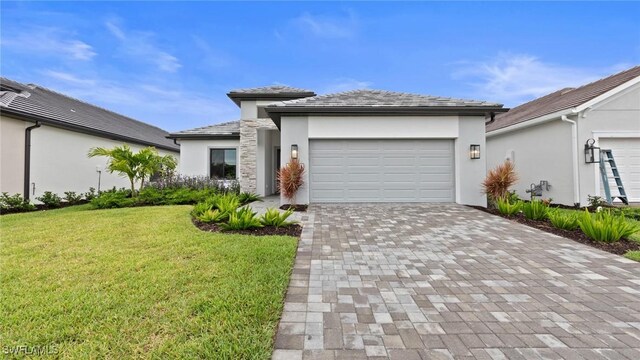 4096 Pegasus Way, Naples, FL 34120 - view of front of house with stucco siding, decorative driveway, a front yard, and a garage