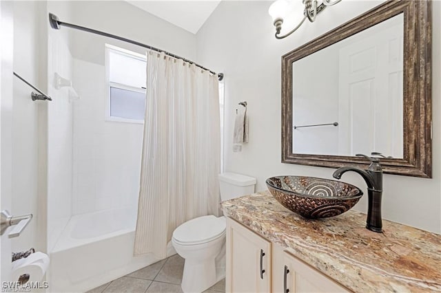 full bathroom featuring tile patterned flooring, vanity, toilet, and shower / bathtub combination with curtain