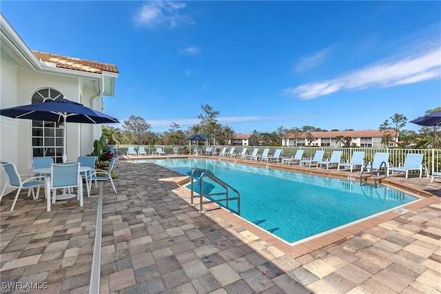 view of swimming pool featuring a patio area