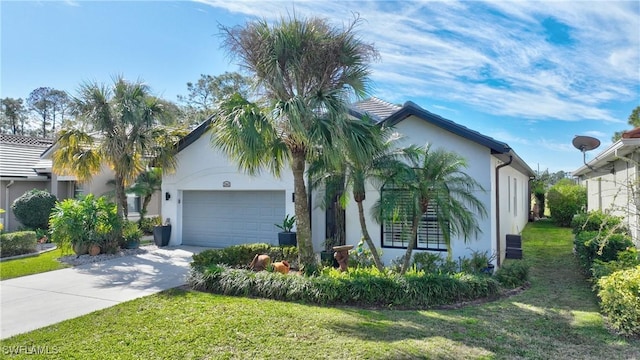 view of front of home with a garage and a front lawn