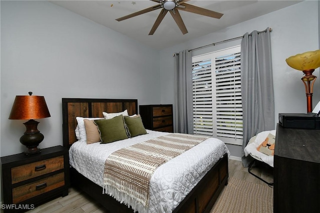 bedroom featuring ceiling fan and light hardwood / wood-style floors