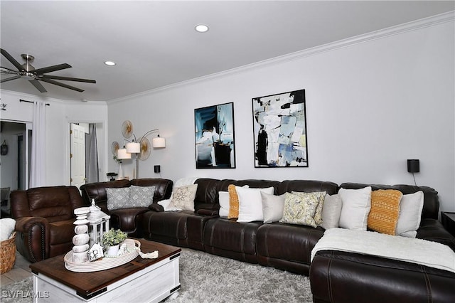 living room featuring ornamental molding and ceiling fan