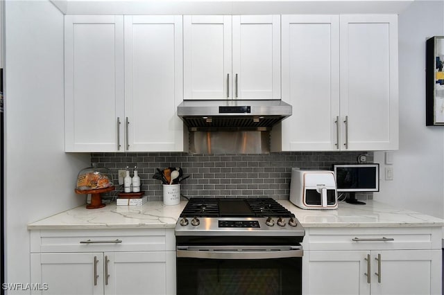 kitchen with white cabinetry, exhaust hood, and stainless steel gas stove