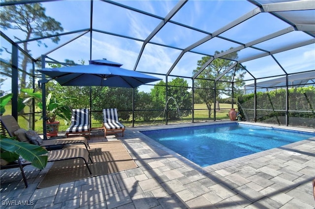 view of pool featuring a patio and a lanai