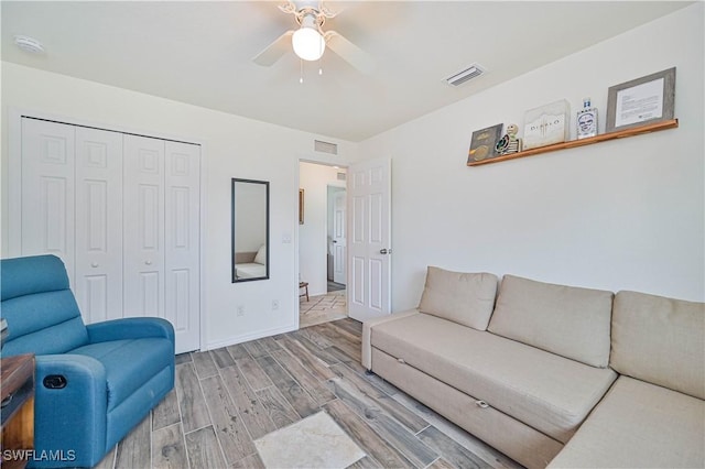 living room featuring ceiling fan