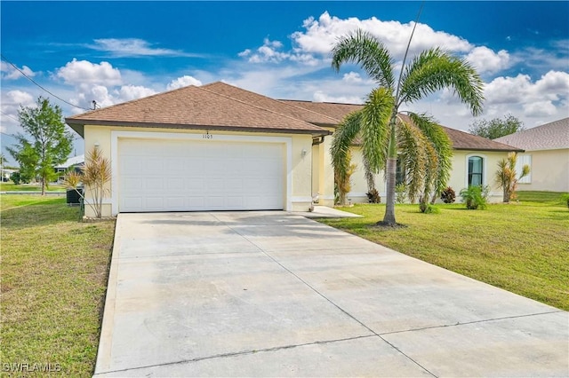 view of front of property with a front lawn and a garage