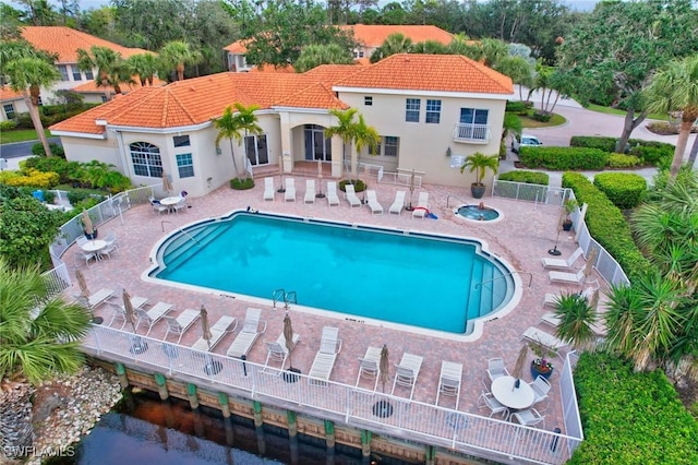 view of swimming pool featuring a patio area