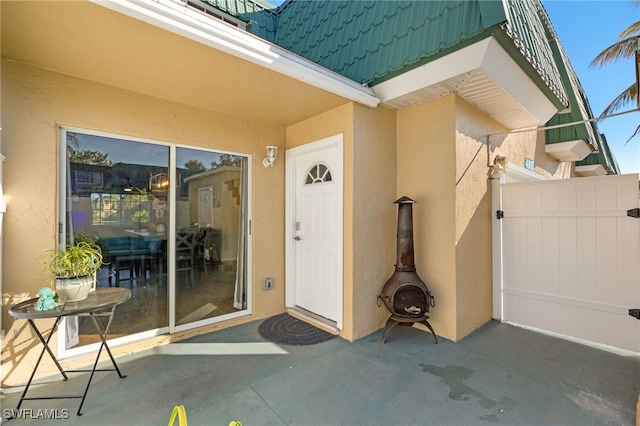 property entrance with a patio