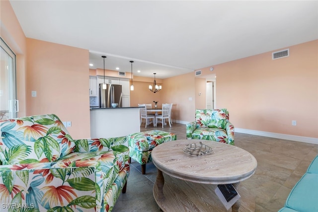 living room with a notable chandelier