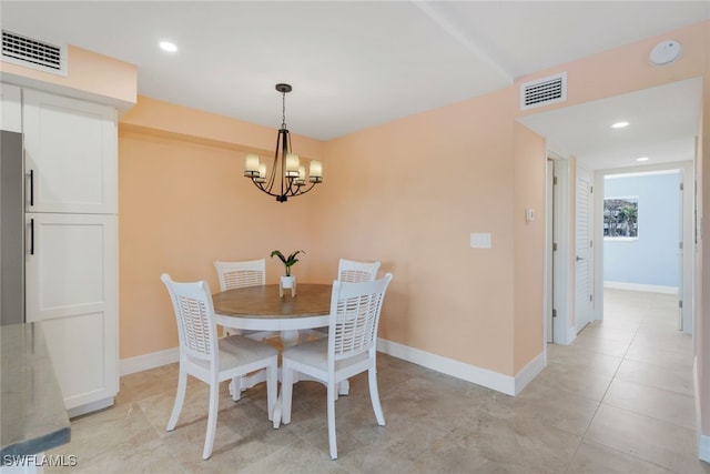 dining area featuring a notable chandelier