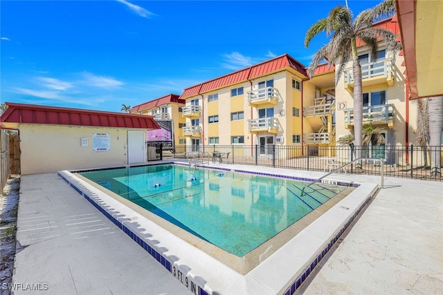 view of pool featuring a patio