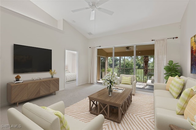 carpeted living area with visible vents, baseboards, high vaulted ceiling, and ceiling fan