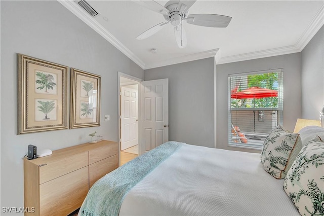 bedroom with vaulted ceiling, ceiling fan, and crown molding