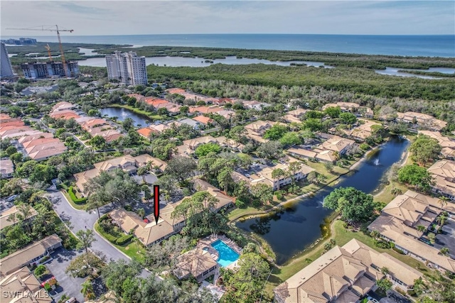 birds eye view of property with a water view