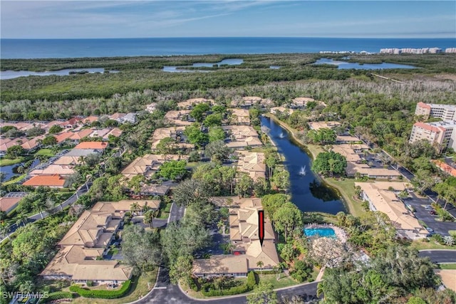 drone / aerial view with a water view