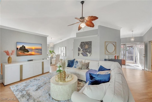 living room featuring a wealth of natural light, light wood-type flooring, ceiling fan, and crown molding