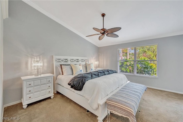 bedroom featuring light carpet, vaulted ceiling, ceiling fan, and crown molding