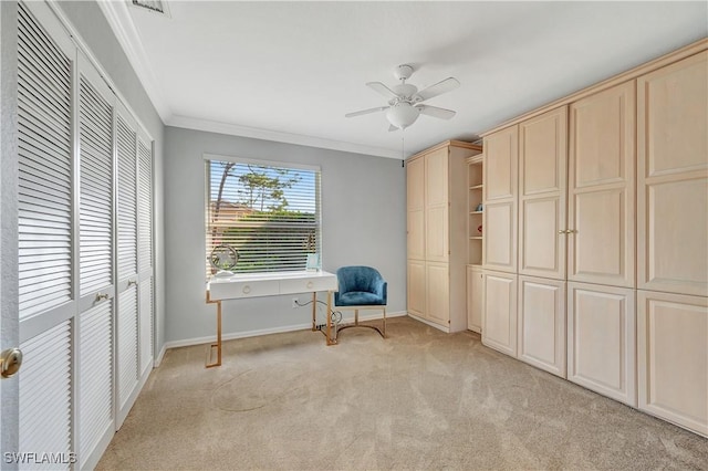 unfurnished room featuring light carpet, ceiling fan, and crown molding