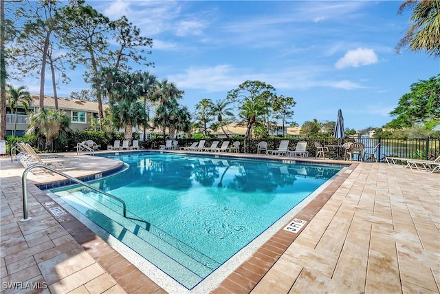 view of swimming pool with a patio