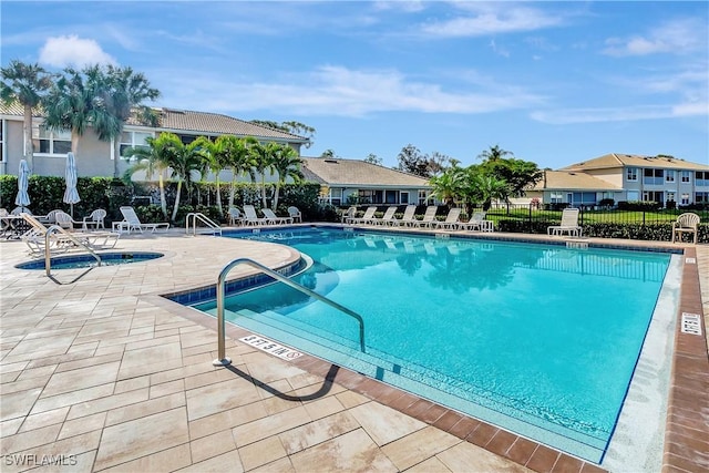 view of swimming pool featuring a patio area