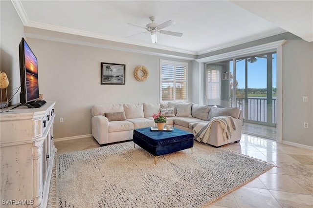 tiled living room featuring plenty of natural light, ceiling fan, a water view, and crown molding