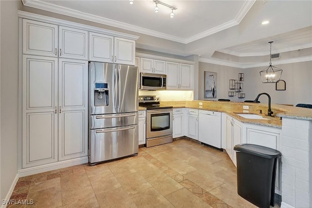 kitchen featuring sink, stainless steel appliances, light stone counters, kitchen peninsula, and white cabinets